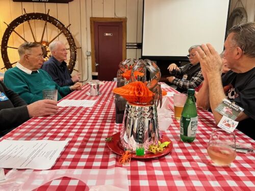 Roger-Rollins-Frank-Robinson-Michael-Sheets-and-Ken-Bakke-discussing-their-latest-boat-projects