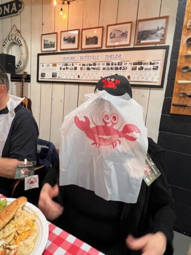 Shy-sandy-Bakke-with-her-crab-bib-over-her-face-to-avoid-a-photo